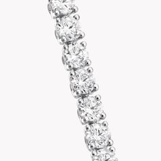 The ultimate expression of timeless design, our round diamond bracelet in white gold from the Classic Graff collection is simply stunning. The diamonds are embraced in minimal metal settings, creating a delicately scintillating statement on the wrist. The Classic Graff collection is the epitome of elegance – a unique selection of jewels designed to showcase the remarkable purity and brilliance of the finest Graff diamonds. An elegant Classic Graff round diamond bracelet with a total weight of ap Luxury White Gold Lab Grown Diamond Bracelet, Everyday Luxury White Gold Diamond Bracelet With Prong Setting, Fine Jewelry White Gold Lab Grown Diamond Bracelet, White Gold Lab Grown Diamond Fine Bracelet, White Gold Lab Grown Diamond Bracelet, White Gold Lab Grown Diamond Bracelet With Brilliant Cut, Timeless White Gold Tennis Bracelet With Diamond Accents, Timeless Platinum Tennis Bracelet With Brilliant Cut, Timeless White Gold Tennis Bracelet With Prong Setting