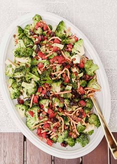 broccoli salad with cranberries, raisins and orange zest in a white bowl