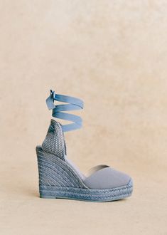 High-heeled espadrilles;Item made in our Spanish atelier;Secures with with laces wrapped around the ankle;Textile exterior;Leather lining and cotton insole;Rubber outsole;Rope-covered heel;Heel height: 11 cm / 4.3 in Cute Vacation Outfits, Blue Espadrilles, Heeled Espadrilles, Lace Wrap, Vacation Outfits, Espadrilles Wedges, Shoe Game, Parisian Style, Chic Outfits