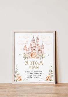 a wedding sign with a castle in the middle and flowers around it on top of a wooden shelf