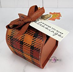 an orange and brown box with a tag on it that says happy thanksgiving to you