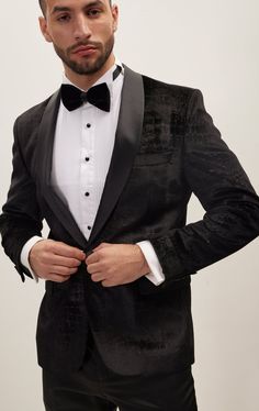 DETAILS Elevate your formalwear with the Shawl Collar Tuxedo Jacket by Ron Tomson—a masterful fusion of classic sophistication and contemporary allure. Meticulously crafted, this jacket boasts a sumptuous velvet touch with a distinctive croc-embossed pattern in black-on-black, infused with a hint of glitter to create a subtle yet captivating sparkle.The croc embossed pattern not only adds a tactile element to the jacket but also introduces a touch of modernity and luxury. The hint of glitter enhances the ensemble, creating a light sparkle that sets you apart at any formal occasion. This distinctive design is a testament to Ron Tomson's commitment to unique and refined fashion.Designed for both style and comfort, this jacket features a slim, tailored fit that enhances the silhouette and ach Violet Perfume, Shawl Collar Tuxedo, Refined Fashion, Embossed Pattern, Tuxedo Pants, Black Tuxedo, Tuxedo Jacket, Mock Neck Sweater, Shawl Collar