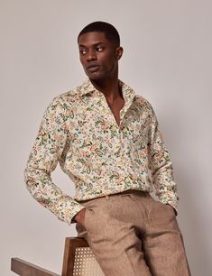 Balancing the natural allure of linen with the vibrancy of floral prints, this premium linen shirt offers breathable comfort and a luxurious feel The cream base adorned with green floral patterns exudes a sophisticated aesthetic for your warm-weather dressing      • 100% Linen   • Slim Fit (Relaxed)   • Single Cuff   • Full Cutaway Collar       The model is wearing a size Medium    Model is 6'2 / 187cm tall, with a 39 / 99cm chest and a 31 / 79cm waist Garden Wedding Suits Men, Floral Outfit Men, Garden Wedding Groomsmen, Men Wedding Attire Guest, Semi Formal Wedding Attire, Floral Attire, Wedding Guest Men, Formal Smart Casual