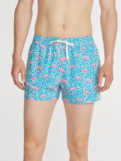 Grab your sunglasses and your flamingo floaty and sink into island time with these classic swimmers. These jealousy-inducing trunks feature an ultra quick drying shell, anti-chafe liner and a zipper back pocket. Not to mention the elastic waistband and build-in drawstring designed to keep your trunks secure from the swim up bar all the way to the all you can eat crab leg buffet. Fabric: Trunk: 92% Polyester/8% Spandex Liner: 91% Polyester/9% Spandex Machine Wash Cold, Tumble Dry Low Best for: Sw 4-way Stretch Swimwear For Summer Pool, Casual Swimwear For Pool In Warm Weather, Blue Tropical Swim Trunks For Pool, Summer Pool Swimwear With 4-way Stretch, Tropical Swimwear With Relaxed Fit For Poolside, Summer 4-way Stretch Swimwear For Pool, Tropical Relaxed Fit Swimwear For Poolside, Tropical Style Relaxed Fit Swimwear For Poolside, Tropical Swim Trunks For Sports In Summer