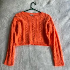 Cute Cable Knit Cropped Sweater By Better Be In The Color Bright Orange. Cable Knit Material, Crew Neck, Wide-Ribbed Edges, Long Sleeves, Padded Shoulders And A Cropped Length. Shell: 100% Wool. Lining: 93% Nylon, 7% Elastane. Size: Women’s S. Only Used Once. In Great, Almost Brand New Condition. No Damages, No Tear Or Wear. Cropped Pointelle Knit Sweater, Cropped Pointelle Knit Cardigan For Winter, Winter Cropped Pointelle Knit Cardigan, Spring Cropped Cable Knit Sweater, Cropped Pointelle Knit Sweater For Winter, Cropped Open Knit Winter Cardigan, Winter Cropped Pointelle Knit Sweater, Cable Knit Cropped Acrylic Sweater, Cropped Cable Knit Winter Sweater