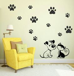 a dog and cat wall decal in a living room with yellow chair, lamp and white rug