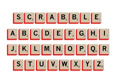 scrabble letters are arranged in red and beige