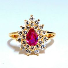 .60ct. Natural Ruby Cocktail Halo Ring Pear Cut Fully Faceted Clean Clarity 5.3 X 3.4mm Vivid Red / Vs Clear Clarity .42ct. Diamonds: Rounds, Full Cuts G-Color, Vs-2 Clarity. 14kt. Yellow Gold. 3.2 Grams. Deck Of Ring: 14mm X 11mm Depth: 6.3mm Current Ring Size: 5 We May Resize, Please Inquire. $5000 Appraisal Certificate Will Accompany. Teardrop Yellow Gold Ruby Ring For Wedding, Gold Ruby Ring Pear-shaped, Yellow Gold Ruby Ring With Prong Setting, Gold Diamond Teardrop Ring With Halo Setting, Pear-shaped Ruby Ring In Gold, Gold Teardrop Diamond Ring With Halo Setting, Pear-shaped Brilliant Cut Yellow Gold Ruby Ring, Pear-shaped Ruby Ring In Yellow Gold With Prong Setting, Gold Pear-shaped Ruby Ring