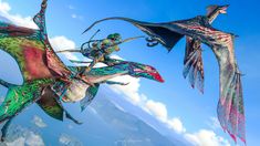 two dragon like creatures flying in the sky