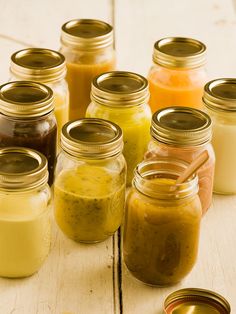 several jars filled with different types of food