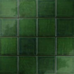 a green tile wall that is very close to the ground with no one in it