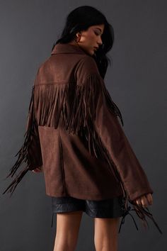 Striking western-inspired design with all-over fringe detailing
Soft suedette fabric for a luxurious touch and feel
Classic collar and button-front closure for versatile styling
Long sleeves with fringe trim for dramatic movement
Relaxed fit silhouette perfect for layering
Make a bold statement with this eye-catching Suedette Western Fringed Jacket from Warehouse. This jacket effortlessly combines edgy style with feminine flair, perfect for the confident woman who loves to stand out. The all-over fringe detailing adds a dynamic element to your ensemble, creating movement and texture with every step. Pair it with sleek leather shorts and a crop top for a night out on the town, or throw it over a flowing maxi dress for a bohemian-inspired look at a music festival. The versatile button-fron Fringe Jacket Outfit, Shorts And A Crop Top, Fringed Jacket, Fringe Jacket, Edgy Style, Floral Outfit, Tshirt Skirt, Confident Woman, Leather Shorts