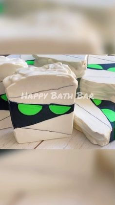 some white and green birthday cakes on a table