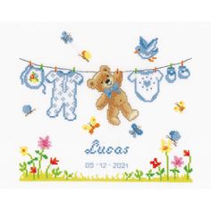 a cross stitch baby's birth card with a teddy bear hanging from a clothes line