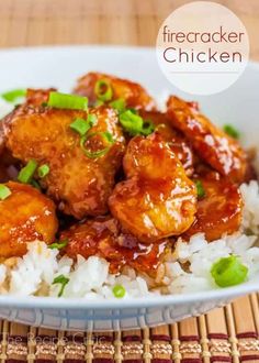 chicken and rice in a bowl with garnishes on the side, ready to be eaten