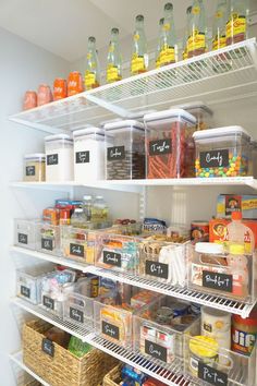 a refrigerator filled with lots of food and labeled labels on it's shelves in a kitchen