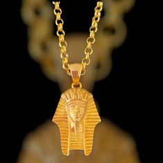 Tutankhamun was an ancient egyptian pharaoh king. Your gold plated Tutankhamen necklace is minimalist and looks eye catching. Your medallion made with 925 carat silver and 22 carat gold plated. Nice minimalist unisex gift for your wife and for your boyfriend. Pendant details: Nickel free hypoallergenic 22 carat gold plated We send your tutankhamun necklace in a special gift pack Gender: Unisex adult Pendant weight: 5-6gram Pendant height: 1.30 inches (3.30cm) Pendant diameter: 0.70 inches (1.80c Ancient Egypt Jewelry, Ancient Egyptian Pharaoh, Egypt Jewelry, Jewelry Minimal, Men Pendant, Egyptian Pharaoh, Pendant For Men, Christmas Gifts For Wife, Minimal Necklace