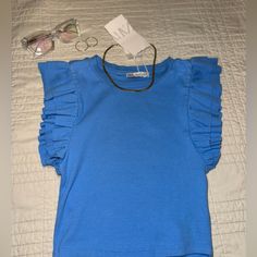 Zara New With Tags S Or M 95% Cotton 5% Elastane 12 In Pit To Pit 16 In Shoulder To Waist Beautiful Sky Blue Top!! Blue Ruffle Sleeve Top For Spring, Blue Casual Tops With Ruffle Sleeves, Trendy Blue Tops With Ruffles, Light Blue Casual Tops With Ruffle Sleeves, Trendy Blue Ruffled Tops, Trendy Blue Zara Tops, Blue Casual Ruffle Sleeve Tops, Fitted Blue Tops With Ruffle Sleeves, Casual Light Blue Tops With Ruffle Sleeves