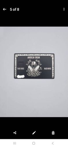 a black and white credit card with the american dream on it's back side