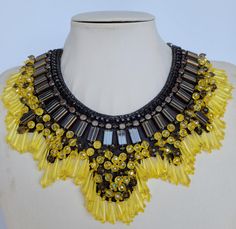 Each piece of our statement necklaces is handmade and one of a kind made in Italy. Our creations is made of high quality materials such as crystals and rhinestones. Each embroidered material is carefully hand sewn. Very glamorous and stylish. Perfect gift to someone you like. Materials Strass stone and Rhinestone in Yellow and transparent color in different dimension.  Black leather backing. Aluminium chain with lobster closure. Measurements Weight approximate 300 grams. Chain lenght 25 cm - 9.8 Unique Yellow Choker Necklace, Handmade Yellow Necklace For Party, Unique Yellow Necklace For Party, Embroidered Material, Necklace Swarovski, Necklace Collar, Jewel Necklace, Crystal Necklaces, Swarovski Necklace