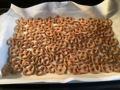 there are many pretzels on the tray ready to be baked in the oven