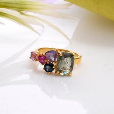 Make a splash with this beautiful prong set multi sapphire  gemstone ring in 925 silver and yellow gold rhodium plated (nikle free). all are products are handmade,absolutely new and unworn . ѻ Gemstone : Natural multi colour sapphires  ѻ Metal : Sterling Silver with yellow gold rhodium plating  ѻ Gemstone Size : multiple                               ѻ Current ring size Available : US 7 ѻ Gemstone Cut : full cut multiple fancy shapes  All of our jewelry are made with handpicked semiprecious stones and gemstones.  Due to the nature of these semiprecious stones a slight variation in colors may be noticed between the pictures and the real piece. Although we guarantee that this is barely noticeable.  Real Gemstones and semiprecious stones naturally consists of inclusions.  In other words these Multicolor Sapphire Gemstone Ring, Gold Multi-stone Pink Sapphire Ring, Fine Jewelry Pink Sapphire Ring With Gemstone Accents, Gold Rings With Multi-stone Pink Sapphire, Yellow Sapphire Birthstone Ring, Luxury Multi-stone Sapphire Ring With Tourmaline, Multi Colored Engagement Rings, Green Sapphire Ring, Multi Gemstone Ring