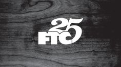 the number twenty five logo is shown on a wooden surface with white lettering that reads, 25