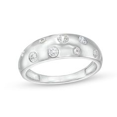 a white gold ring with five diamonds on the outside and four round stones in the middle