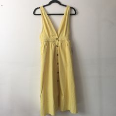 Butter Yellow Pinafore Dress From Urban Outfitters. Brand New With Tags. I Purchased Last Season And Never Wore It. The Color Is Richer Than It Looks In The Pictures. A Really Sweet Dress. 100% Cotton. Has Pockets!! And Tortoiseshell Buttons. Great For Any Season (Layered With Tights And A Turtleneck Or Chunky Sweater!) Measurements When Laying Flat: Ptp 16” Stretched Waist 14” Hips Up To 22” Length From Shoulder 44” But Straps Are Adjustable Sleeveless Buttoned Dresses For Brunch, Sleeveless Brunch Dress With Buttons, Sleeveless Dresses With Buttons For Brunch, Spring Sundress With Button Closure, Fitted Spring Pinafore Dress Sundress, Fitted Pinafore Sundress For Spring, Fitted Pinafore Dress Spring Sundress, Urban Outfitters V-neck Sundress For Summer, Spring Sundress With Buttons For Casual Wear