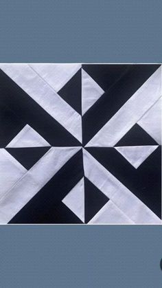 the black and white quilt is on display