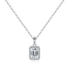 A contemporary bezel setting highlights the beauty of a sleek emerald-cut diamond in this elegant pendant. The length of the necklace can be adjusted to 16" or 18" to suit personal preference. Style ID: N210052Metal: SilverMetal Color: WhiteRhodium Finish: YesNecklace Length: 18inStone(s): MoissaniteTotal Weight (CT. T.W.): 2.22ctCenter Stone T.W.: 2ctStone Dimension: 6*8mmStone Shape: EmeraldStone Color: DStone Setting: Prong Set, Pavé Jewelry Promotion, Pendant Diamond, Moissanite Necklace, Jewelry Workshop, Emerald Cut Diamond, Halo Pendant, Elegant Pendant, Diamond Settings, Emerald Cut Diamonds