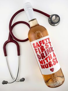 a bottle of alcohol next to a stethoscope