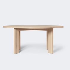 an oval wooden table on a white background