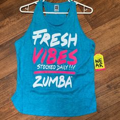 a blue tank top that says fresh vibes stacked daily with zumba on it