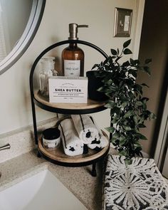 the bathroom is decorated with black and white items, including soaps, hand sanitizers, and other personal care products