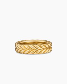 a yellow gold ring with twisted design