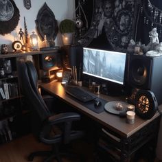 a desk with a computer and speakers on it