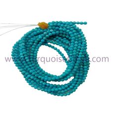 the beads are blue and have gold accents on each strand, which is attached to a hook