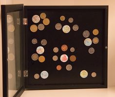 a display case with lots of coins in it