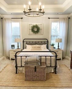 a bed room with a neatly made bed and a basket on the floor next to it