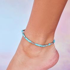 Brighten up your summer wardrobe with our Turquoise Bead Stretch Anklet! A vibrant way to liven up any look, this easy slip-on style anklet is the perfect beach accessory. Cheap Blue Anklets With Colorful Beads, Colorful Beads Anklet For Beach Season Vacation, Colorful Beaded Anklets For Beach Vacation, Colorful Beaded Anklets For Vacation And Beach Season, Trendy Turquoise Beaded Bracelets For Summer, Trendy Anklets With Round Beads For Festivals, Casual Turquoise Beaded Bracelets For Festival, Turquoise Beaded Bracelets For Beach Season, Blue Beaded Bracelets For Summer Festival