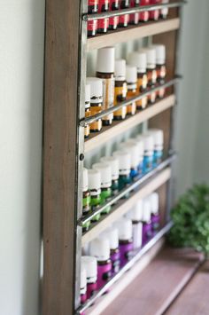 Essential Oil Display Shelf Constructed of Pine and Steel. Holds up to 32- 15ml bottles OR 36- 5ml bottles. Could also hold nail polish, trinkets, or spices! SIZE 12 x 16 1/2 inches See listing picture for specific measurement diagram. COLOR 5 stain color options available. Shown in Classic Grey. Please see the last picture for stain color options. HARDWARE Two keyholes are routed into the back for flush-mounted hanging. We recommend hanging with screws and drywall anchors, not included. SHIPPIN Essential Oil Display Ideas, Essential Oil Display, Oil Display, Nail Polish Display, Oil Shelf, Essential Oil Shelf, Drywall Anchors, Polish Display, Retreat Ideas