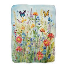 a painting of colorful flowers and butterflies on a blue background with watercolor paint effect