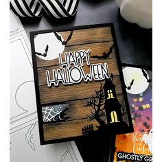 a halloween card with the words happy halloween on it and some other cards next to it