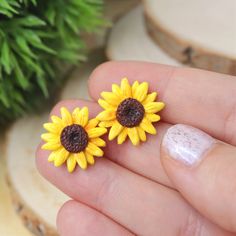 This Sunflower Earrings is the prettiest, one of a kind jewelry that you have been looking for! If you want to have a beautiful yellow flower earrings, or just searching for the perfect gift for girls, or bridesmaids, then you have came to the right place! D E T A I L S: * Handmade Sunflower Stud Earrings * Made from Polymer Clay * Width: 0.7 inches (1.8 cm) * Earring posts: Stainless steel * Earrings are light and easy to wear * Earrings arrive nicely packed in a eco friendly box You can also a Summer Gift Jewelry With Sunflower Design, Yellow Sunflower Design Earrings For Gift, Yellow Sunflower Design Earrings For Summer, Yellow Sunflower Design Earrings Gift, Yellow Sunflower Design Earrings As Gift, Yellow Flower Shaped Jewelry With Sunflower Print, Yellow Sunflower Design Flower Earrings As Gift, Yellow Flower-shaped Jewelry With Sunflower Print, Summer Flower Earrings With Sunflower Design