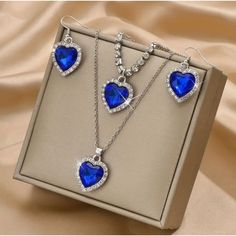 Thanks For Stopping By! While You're Here Please Take A Look At The Other Items In My Shop. Bundle And Save! About This Item: Blue Glass Heart Necklace (18") Bracelet (Adjustable 8-10") Earrings Set Rhinestone Surround Silver Tone, Jewelry Box Not Included Thank You For Looking! Condition: New With Tags Blue Heart Pendant Jewelry For Party, Sapphire Jewelry For Valentine's Day, Blue Jewelry For Valentine's Day Party, Blue Heart Cut Jewelry For Party, Elegant Blue Jewelry For Valentine's Day, Blue Crystal Jewelry Sets For Gifts, Silver Heart-shaped Metal Jewelry Sets, Silver Heart-shaped Jewelry Sets For Party, Silver Heart Jewelry Sets For Party