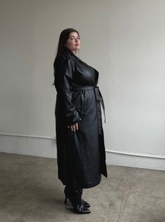 Look your best in this timeless Plus Size Faux Leather Trench Coat. Made out of a luxurious faux leather, it features a flattering fit and double pockets for an added touch of style. You'll make a lasting impression in this sophisticated coat! This coat features a folded-down collar, a tie around the waist, double pockets, and a long length. The material is a super soft faux leather. This coat is made out of 70% Polyurethane and 30% Rayon and a lining that is 100% Polyester. Imported. Hand wash Plus Size Leather, Plus Size Trench Coat, Faux Leather Trench Coat, Nice Women, Long Leather Coat, Leather Trench, Womens Style, Plus Size Outerwear, Car Coat