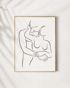 a black and white drawing of two people hugging