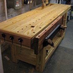 a workbench made out of wood in a shop