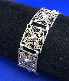 * Vintage 925 Sterling Silver Beaded Filigree Delicate Square Panel Bracelet * Length: 7-1/2" * Width: 5/8" * Weight: 9.3g * Closure: Spring ring * Marked: STERLING * 925 * Condition: As pictured. * S5469    Exported By ExportYourStore :) Classic Adjustable Bracelet With Intricate Design, Classic Adjustable Sterling Silver Bracelet With Intricate Design, Classic Sterling Silver Bracelet With Intricate Design For Wedding, Classic Sterling Silver Bracelet With Intricate Design, Classic Sterling Silver Bracelet With Intricate Design As Gift, Classic Sterling Silver Bracelet With Filigree, Classic Silver Bracelets With Intricate Design, Elegant Sterling Silver Bracelet With Intricate Design, Elegant Engraved Silver Beaded Bracelets